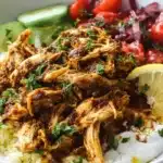 Slow-cooked Crock Pot chicken shawarma in a crock pot with herbs and spices