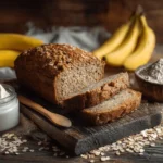 High protein banana bread loaf sliced with ingredients