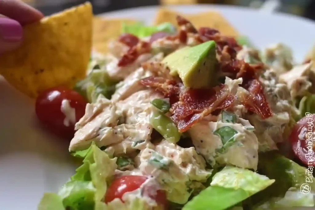 Delicious BLT Chicken Salad with crispy bacon, lettuce, tomato, and grilled chicken.