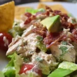 Delicious BLT Chicken Salad with crispy bacon, lettuce, tomato, and grilled chicken.