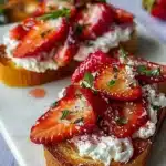 Roasted Strawberry Whipped Ricotta Toast 7 Roasted strawberry whipped ricotta toast topped with fresh strawberries and mint