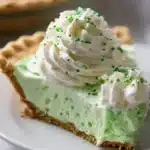 Shamrock Shake Pie 7 Delicious Shamrock Shake Pie with green mint filling and whipped cream topping
