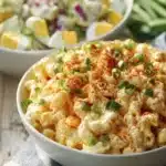 Deviled Egg Pasta Salad 9 Delicious Deviled Egg Pasta Salad served in a bowl with fresh herbs