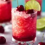 Honey Sweetened Fresh Cherry Limeade 12 Refreshing honey sweetened fresh cherry limeade drink in a glass