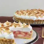 Rhubarb Tart (with or without Meringue) 8 Delicious Rhubarb Tart topped with fluffy meringue on a rustic wooden table